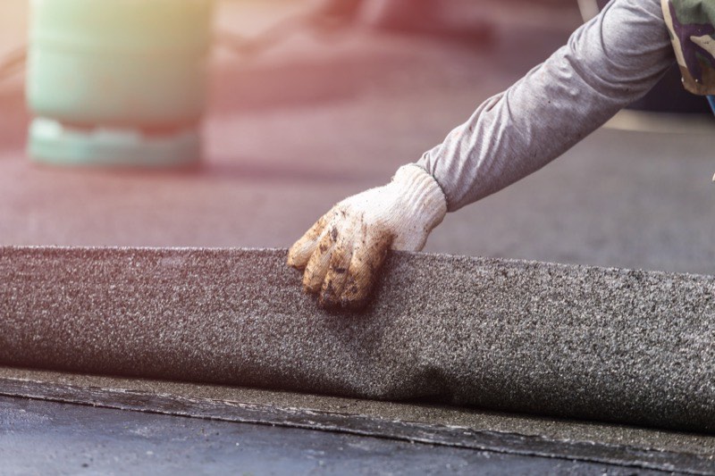 Liquid waterproofing membrane applied to a roof deck