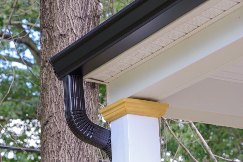 Downspout being flushed clear