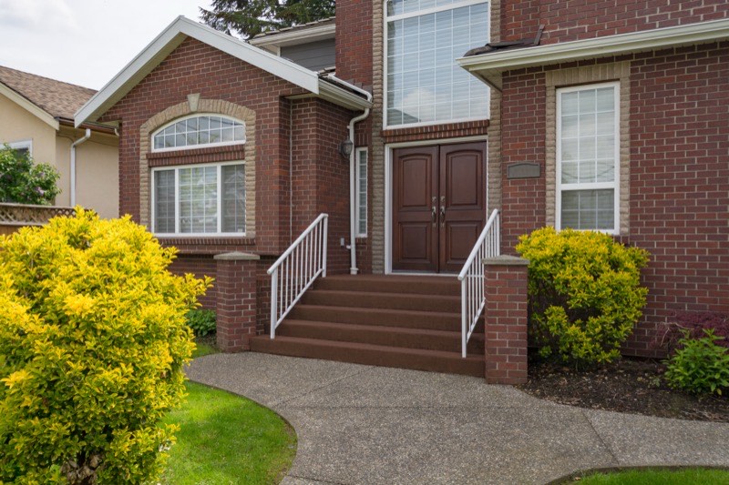 Brick front steps being repaired